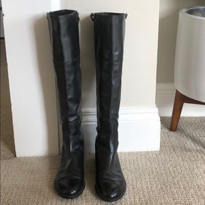 Stuart Weitzman black leather knee-high boots.